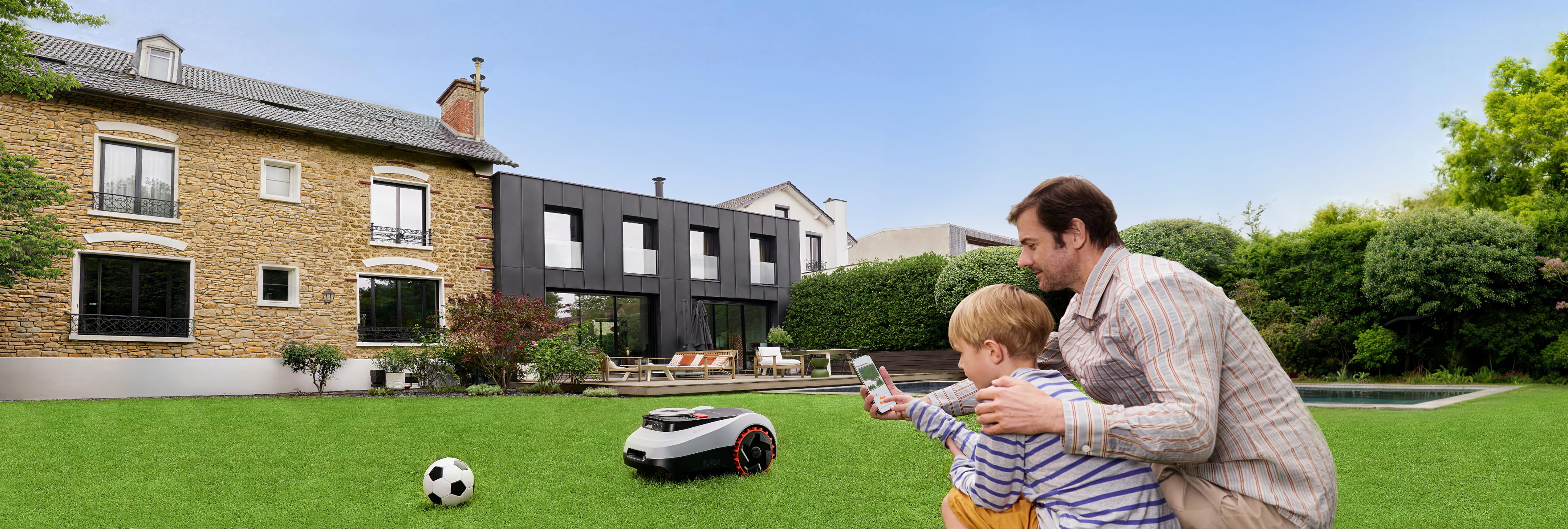 Navimow i Series robot lawn mower on a green lawn.