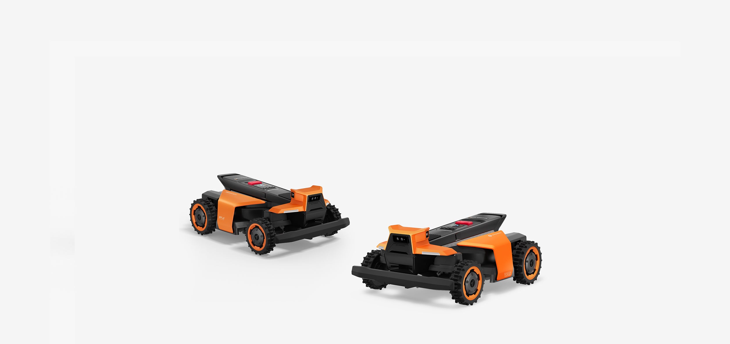Two orange Navimow i110N robot lawn mowers on white background.