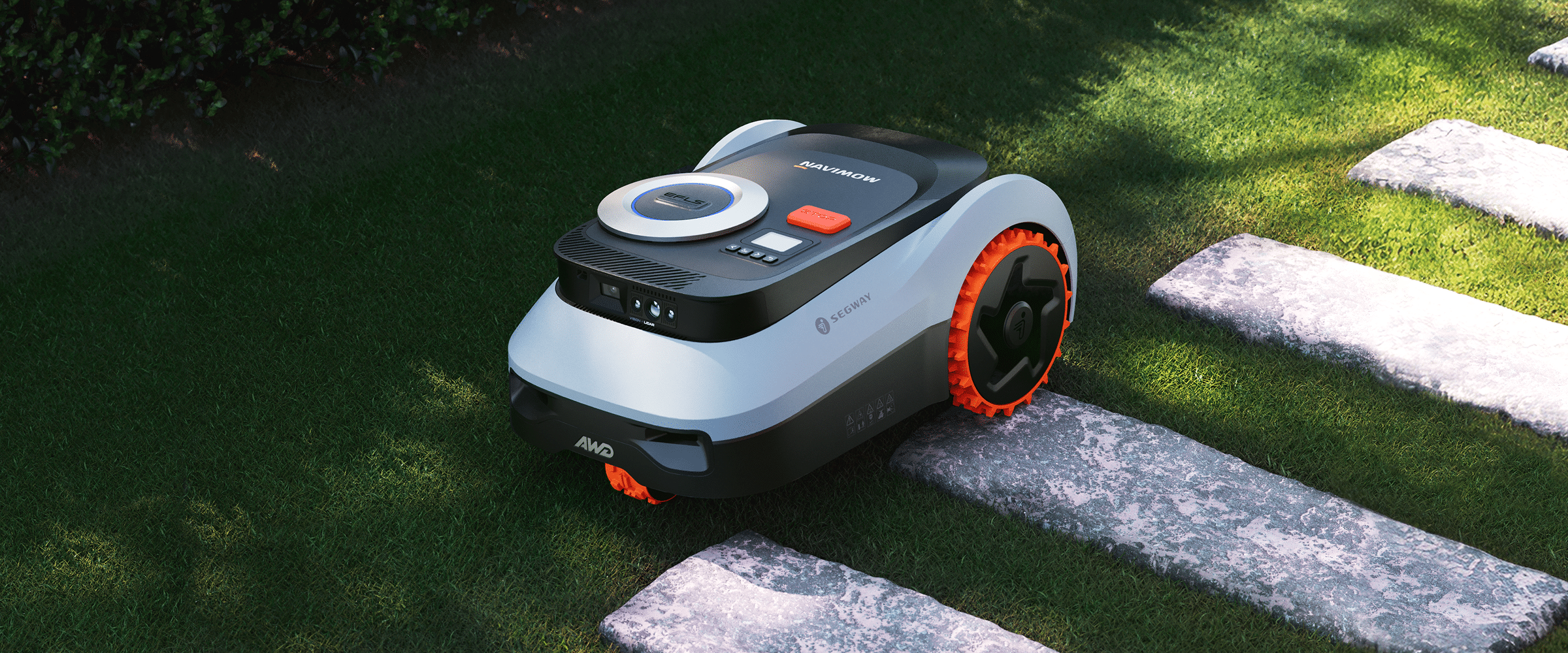 Segway Navimow AWD robot lawn mower on a green lawn.