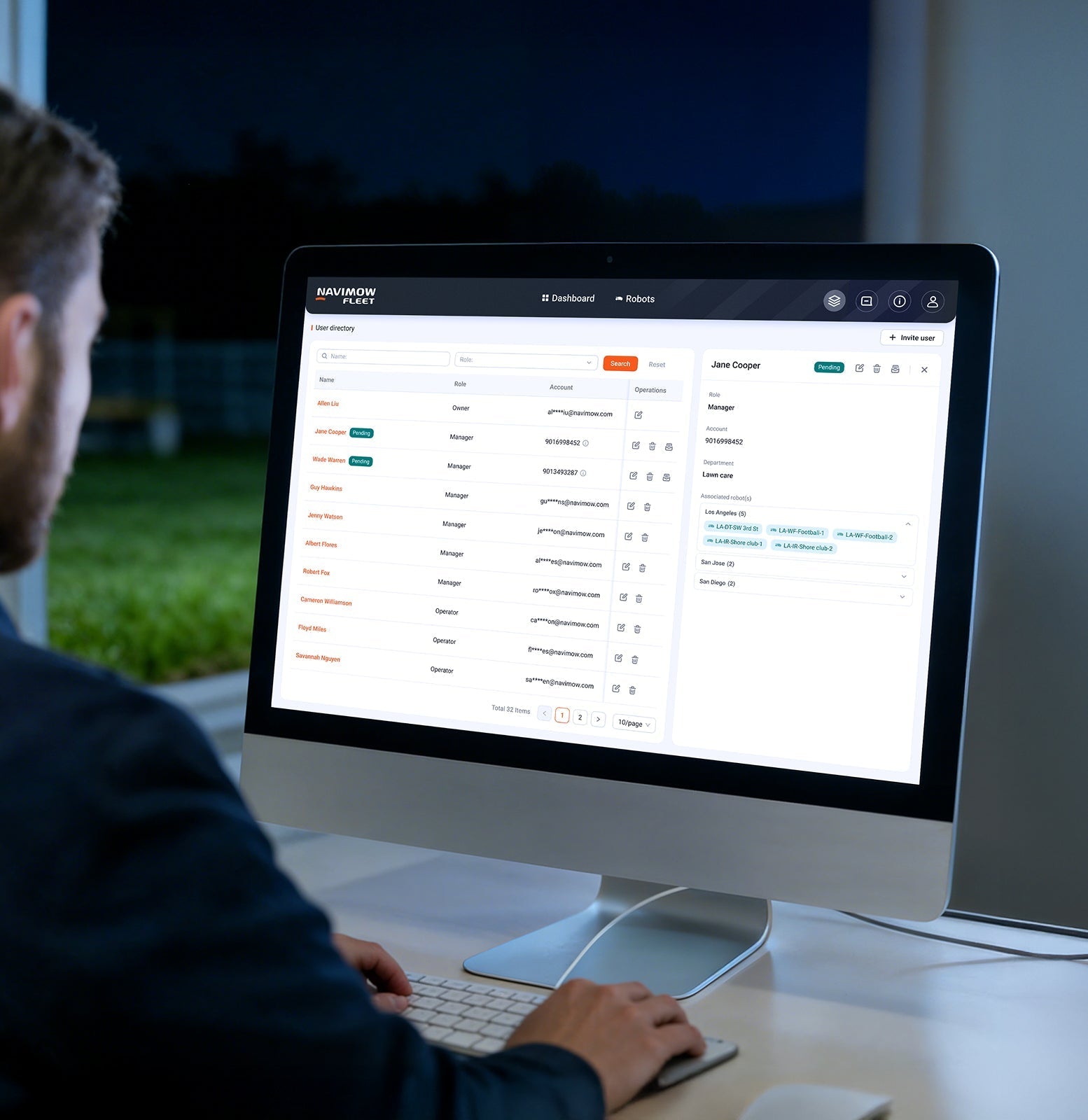 A man using the Navimow Fleet robot lawn mower dashboard.