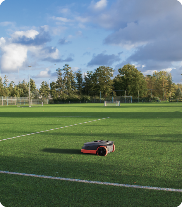 Segway Navimow i105E robot lawn mower on a soccer field.