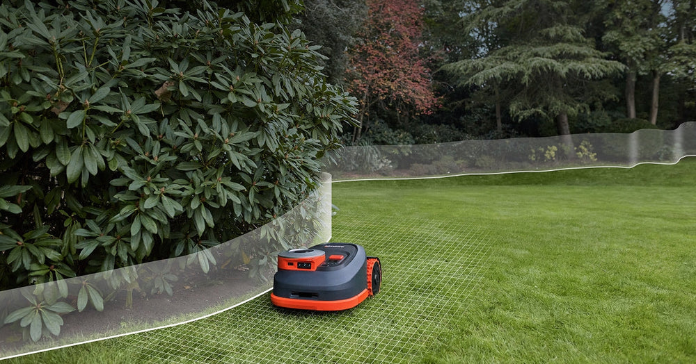 Navimow i110N robot lawn mower mows grass in the garden.