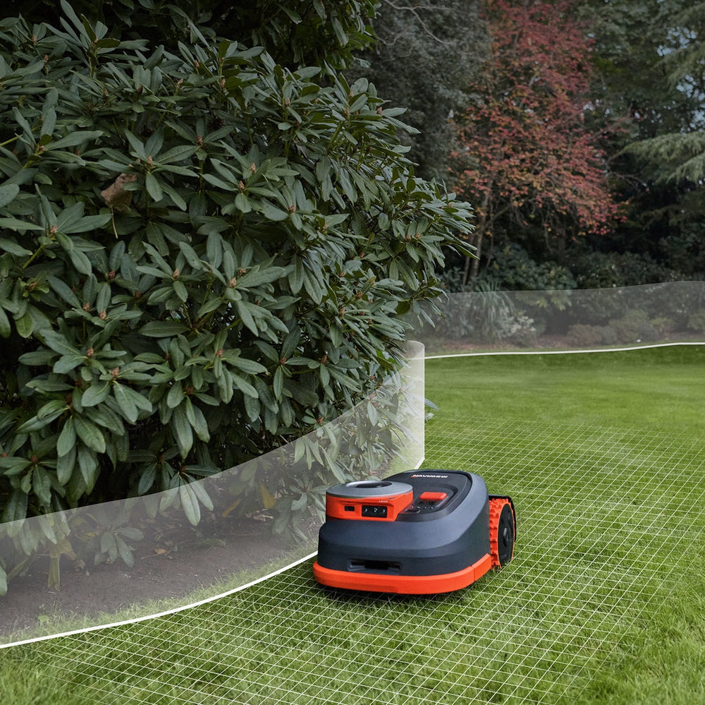 Navimow i110 robot lawn mower is mowing a green lawn.