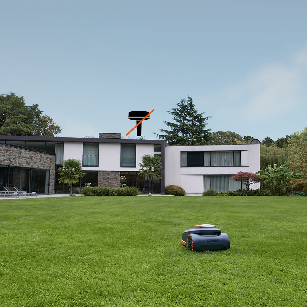 Navimow i Series robot lawn mower on large green grass.