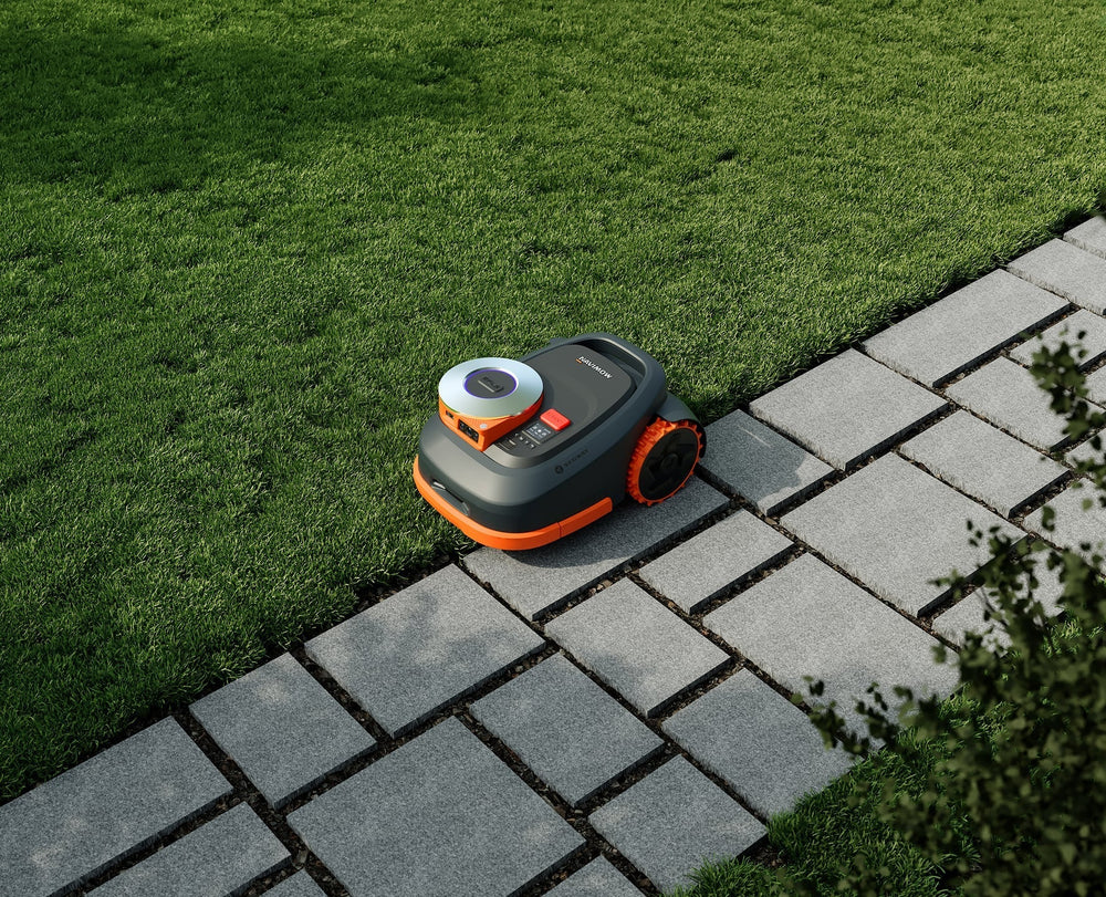 Segway Navimow i105E robot lawn mower on a green lawn.