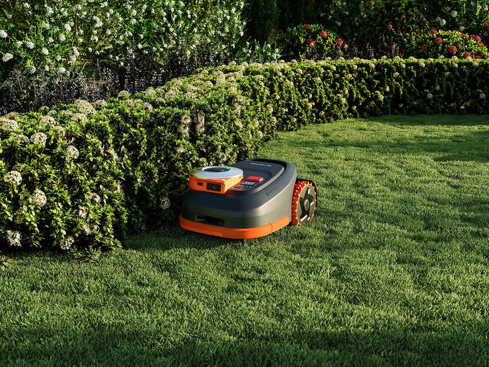 Navimow i Series robot lawn mower mows the green garden.