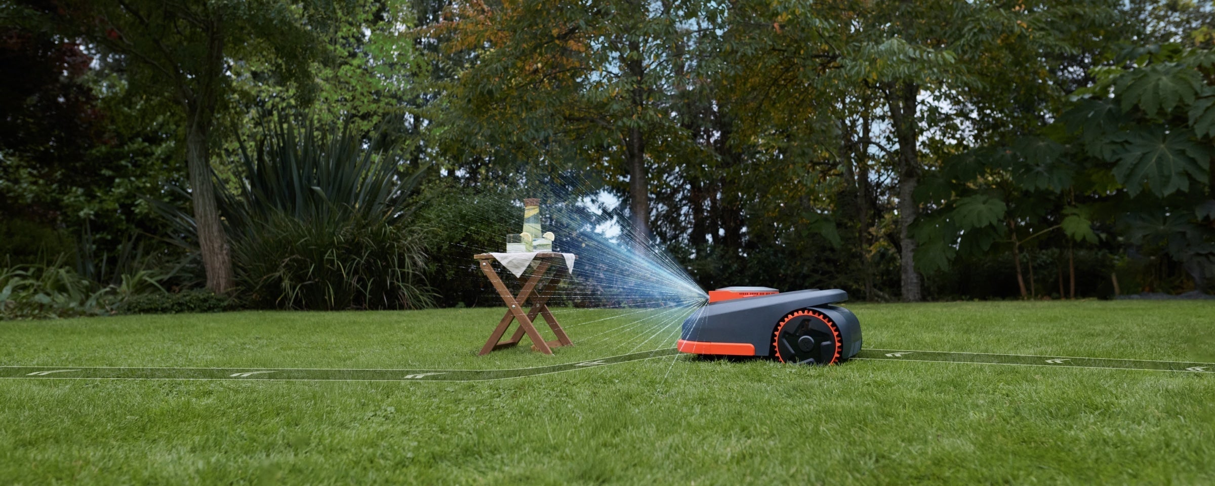 Navimow i110N robot lawn mower on a lush green lawn.