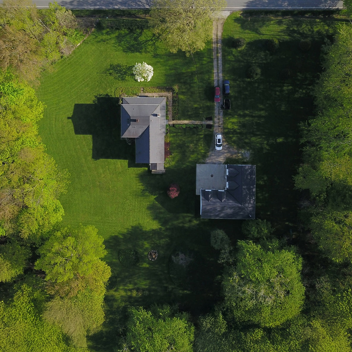 Navimow i110N robot lawn mower on a large green lawn.
