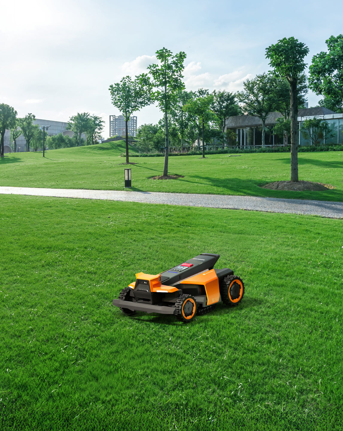 Navimow i110E robot lawn mower sits on a green lawn.