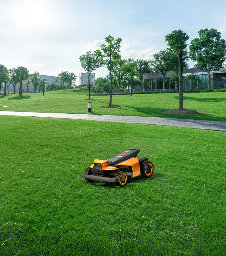 Segway Navimow i Series robot lawn mower on green grass.