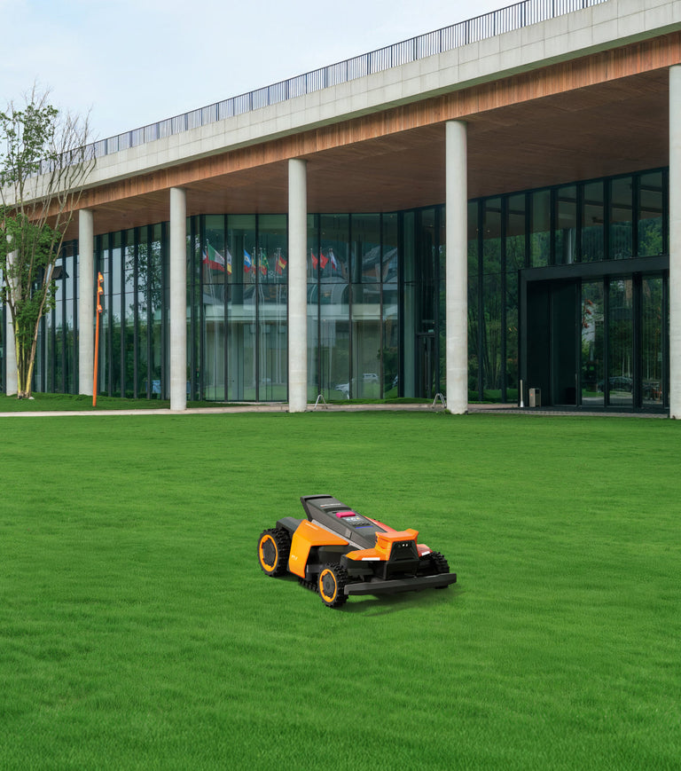 Navimow i105E robot lawn mower on the lush green lawn.