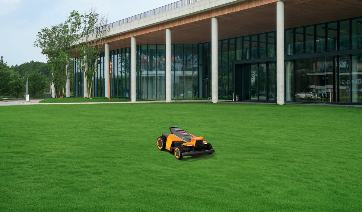 Navimow i110N robot lawn mower mows the lush green lawn.