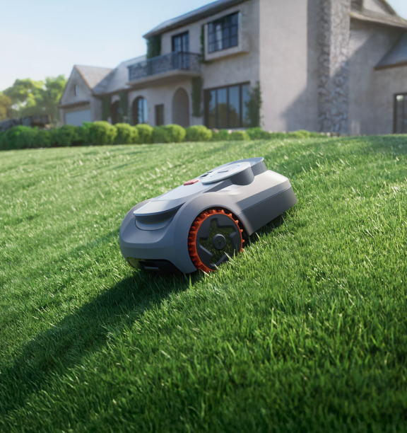 Navimow i Series robot lawn mower on a green slope.