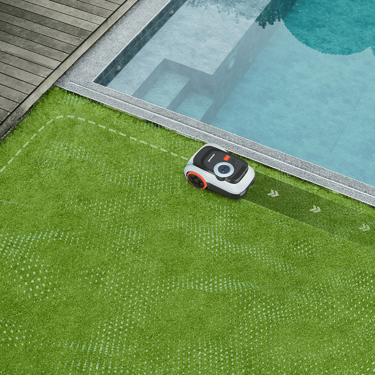 Navimow i Series robot lawn mower mows grass beside pool.